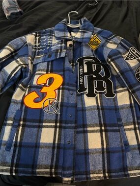 First Row Blue Plaid Patchwork Shacket with Graphic Patches